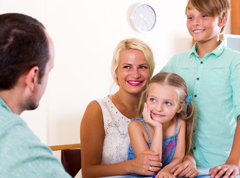 financial advisor talking to a family of three