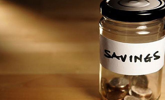 A glass jar containing money.